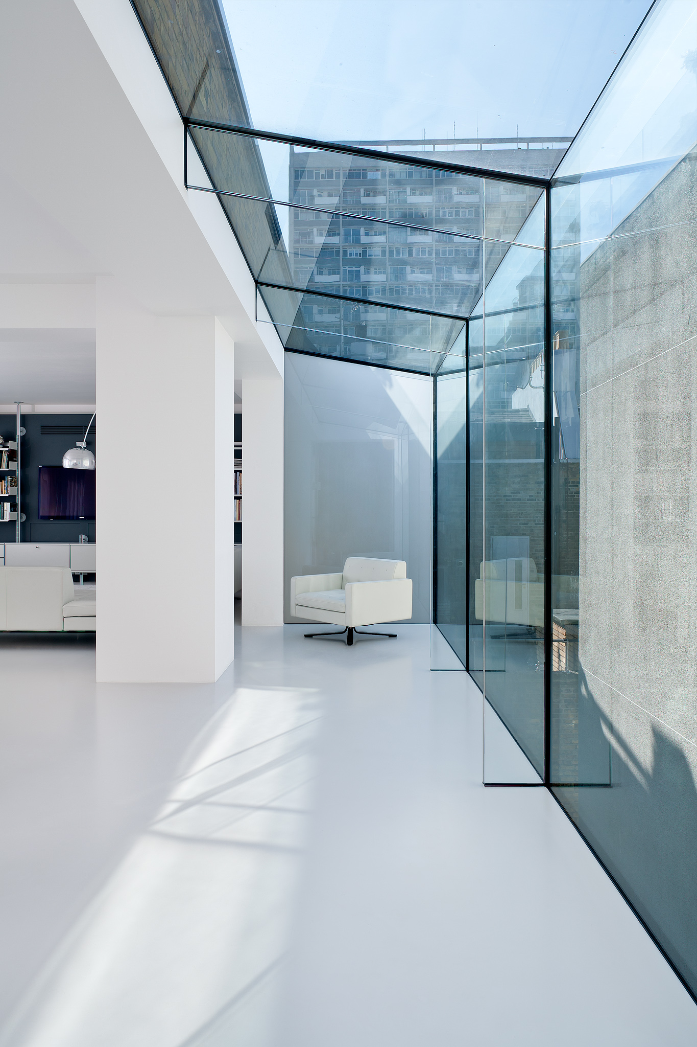 Luxury and contemporary architecture design by NGA in London: glass roof in corridor