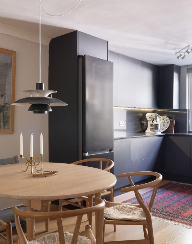 For Sale: Powis Square Notting Hill W2 contemporary kitchen with dark cabinets and wooden dining table