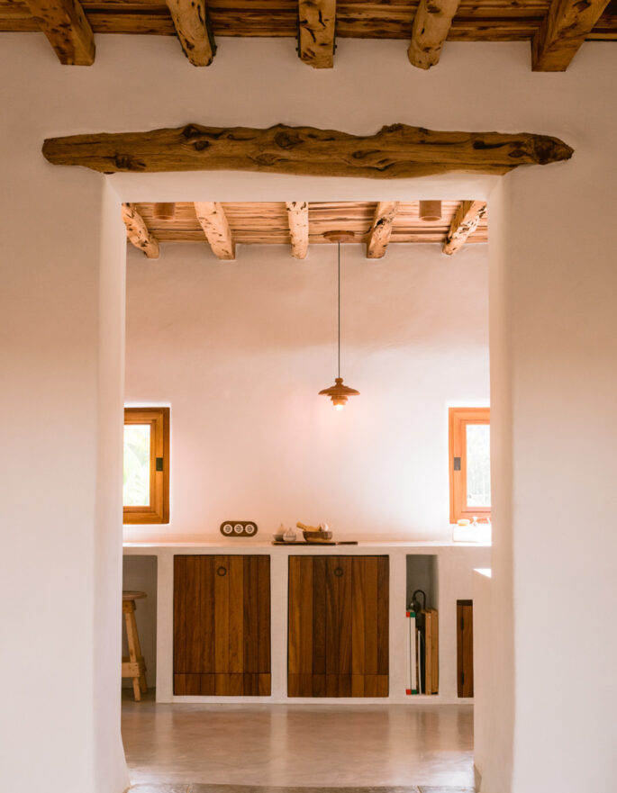 Wooden ceilings crown a stylish kitchen in a luxury villa in Ibiza