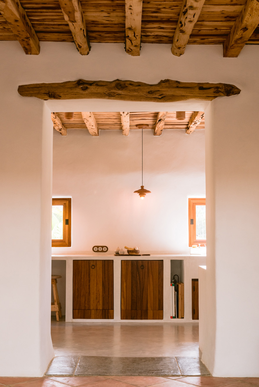 Wooden ceilings crown a stylish kitchen in a luxury villa in Ibiza