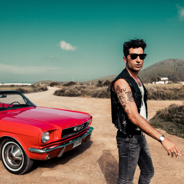 Outdoor image of Diego Calvo and classic car