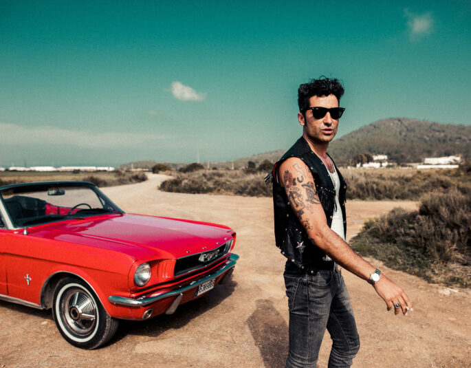 Outdoor image of Diego Calvo and classic car