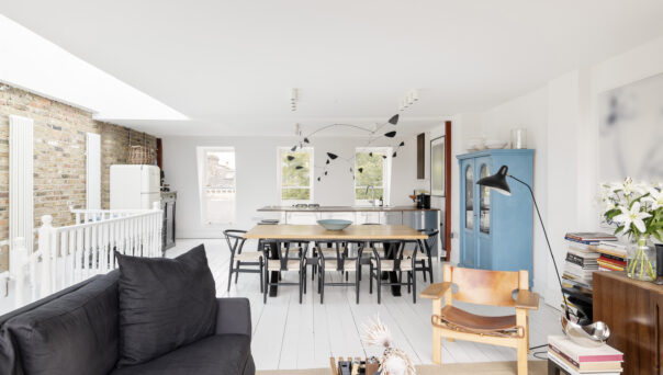 Bright open-plan kitchen, dining and reception room with a skylight, in a duplex apartment for sale