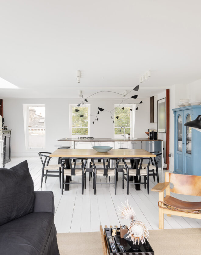 Bright open-plan kitchen, dining and reception room with a skylight, in a duplex apartment for sale
