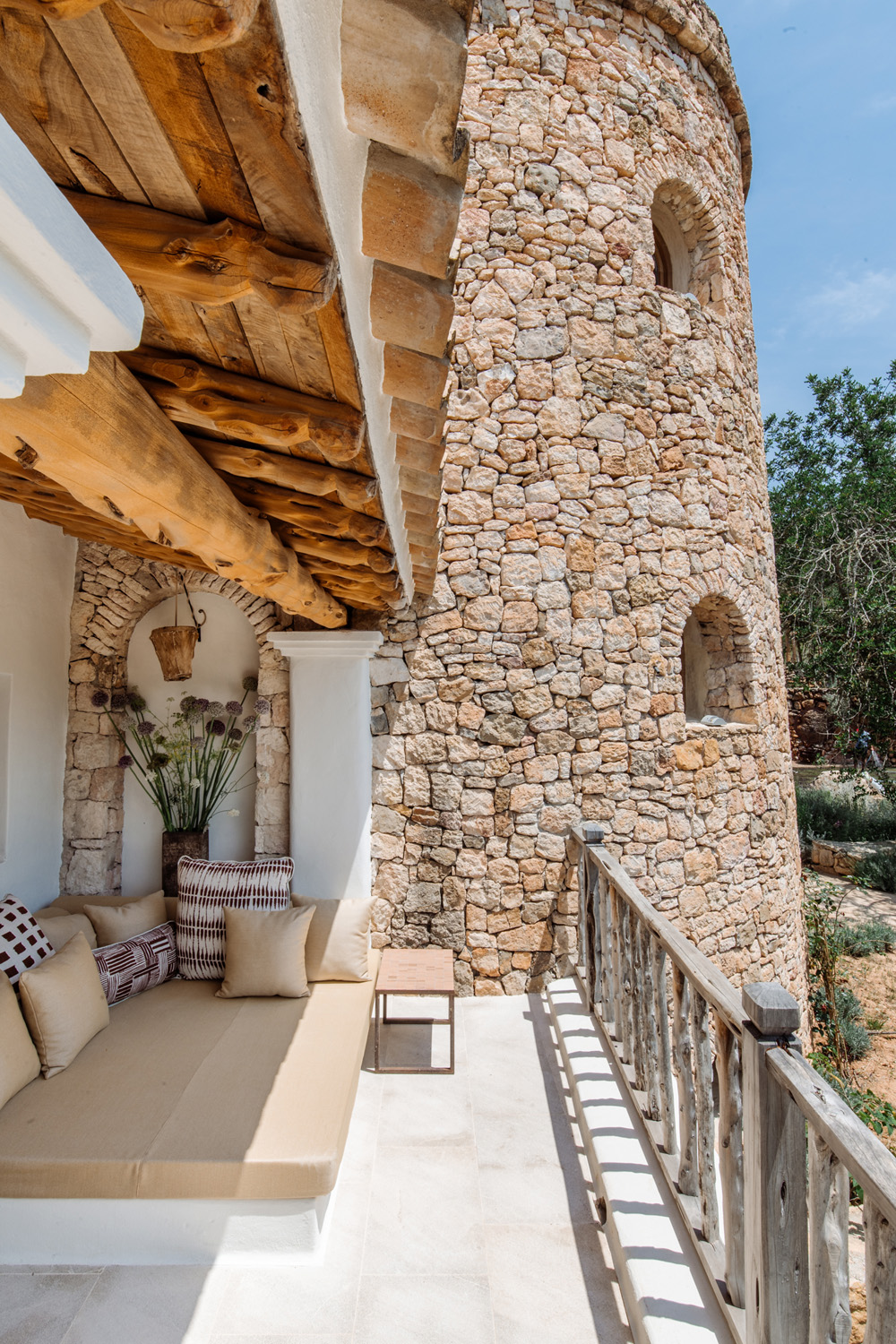 Terrace overlooking the rounded turret room of a luxury villa to rent in Ibiza