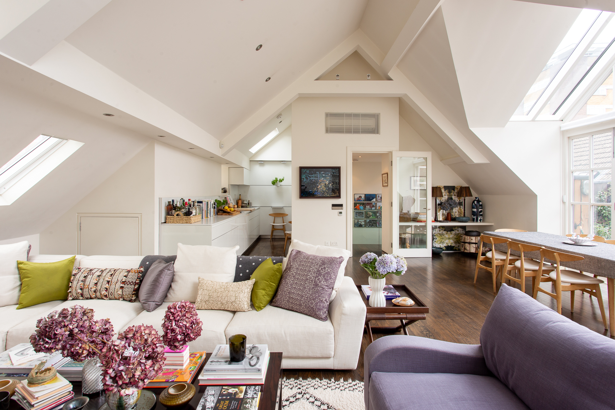 Open-plan living space with vaulted ceiling in a three-bedroom Holland Park maisonette for sale