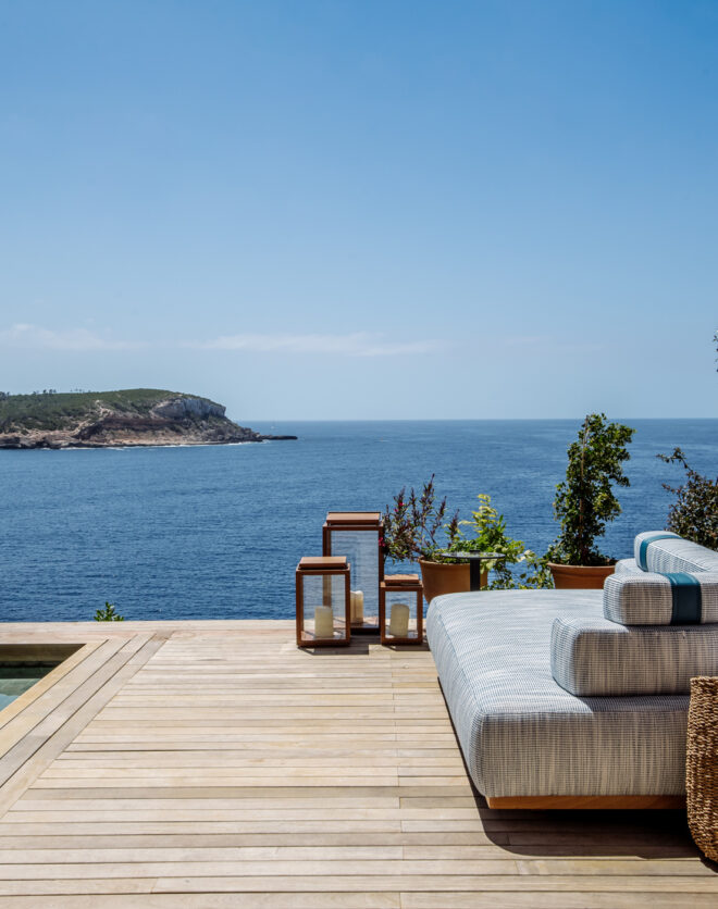 Pool and deck of a luxury rental villa overlooking the north east coast of Ibiza