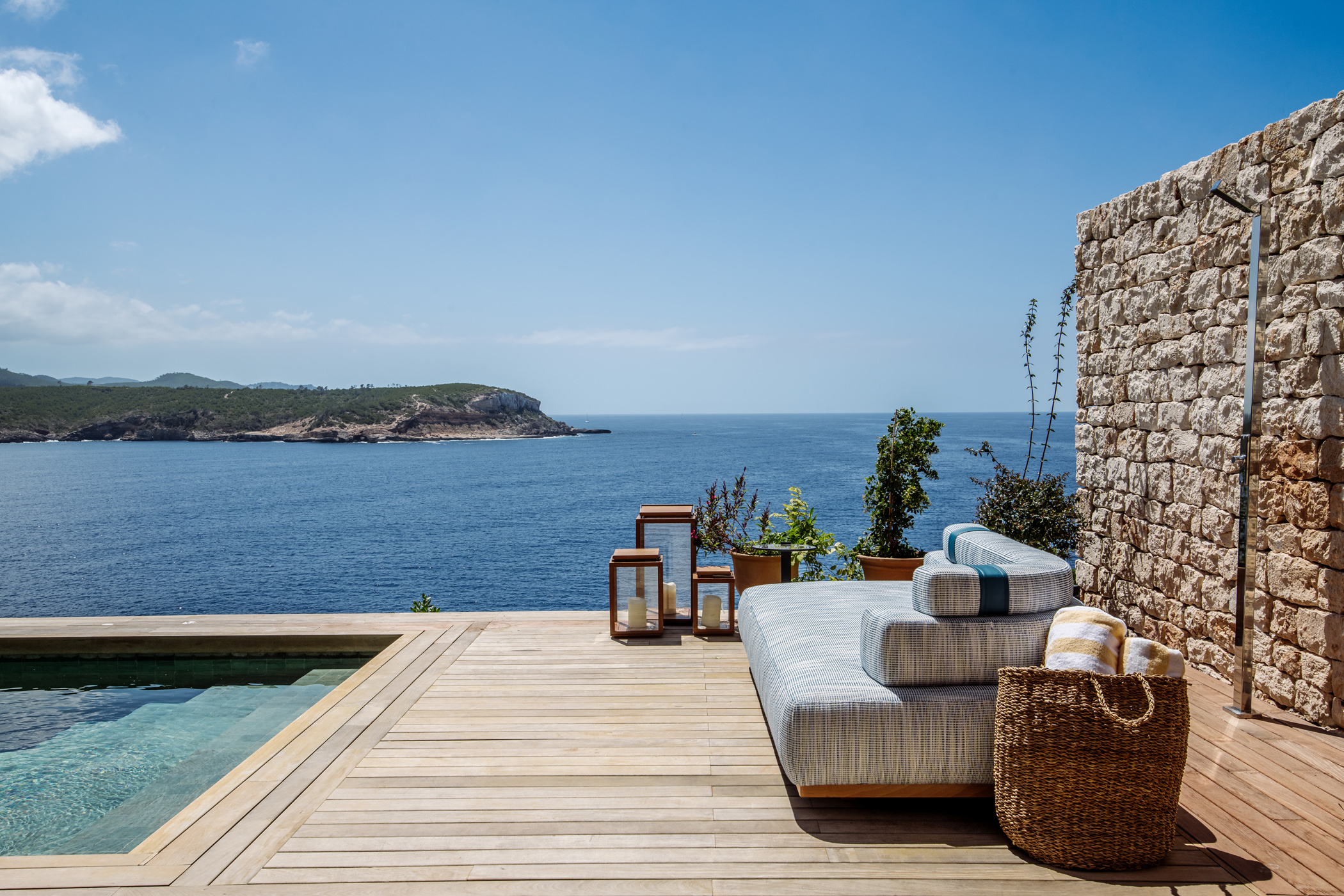 Pool and deck of a luxury rental villa overlooking the north east coast of Ibiza