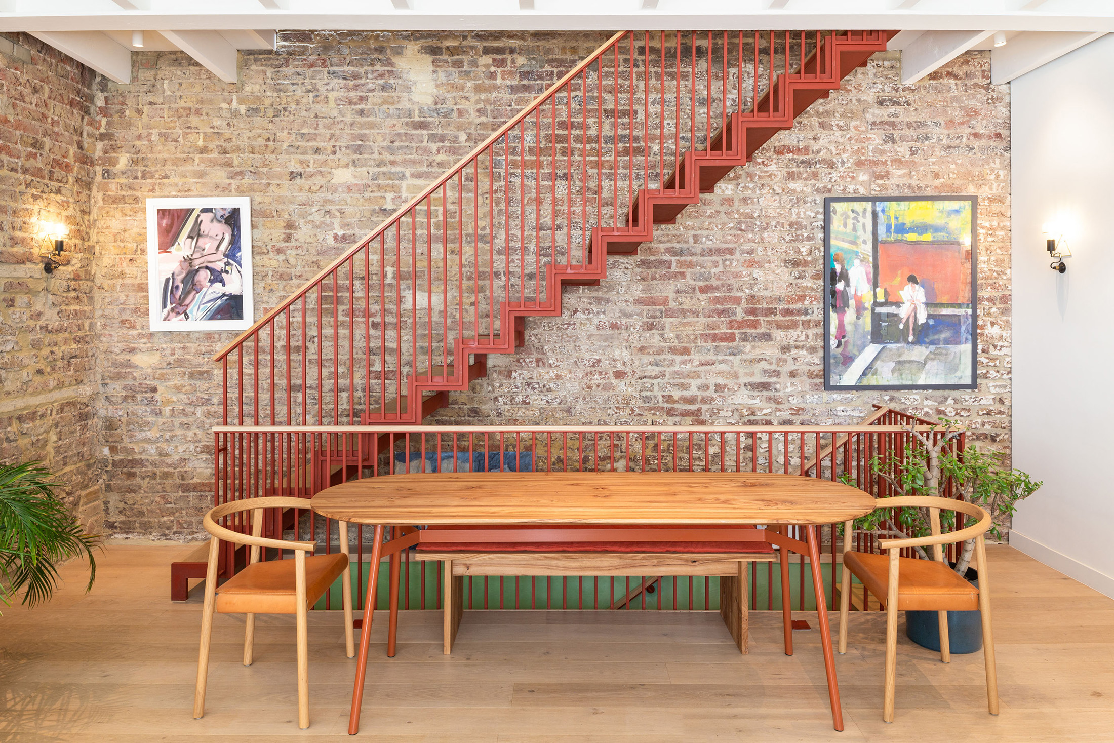 Red staircase and exposed brick wall Princes Mews