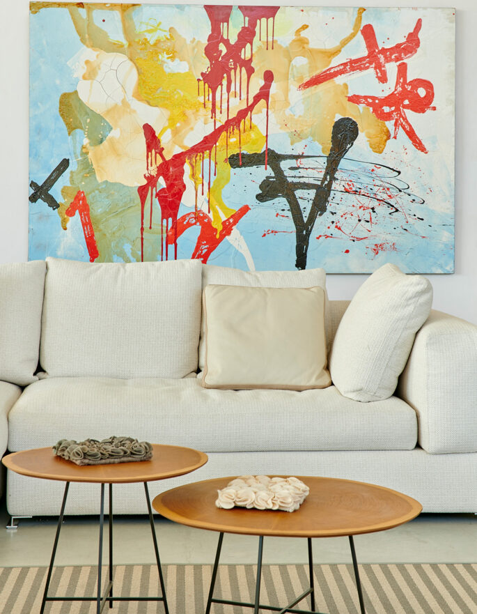 White sofa and artwork by Ibermaison - luxury interior design and furniture in Ibiza