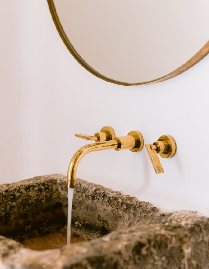 Brassware of a rustic bathroom in a luxury villa in Ibiza