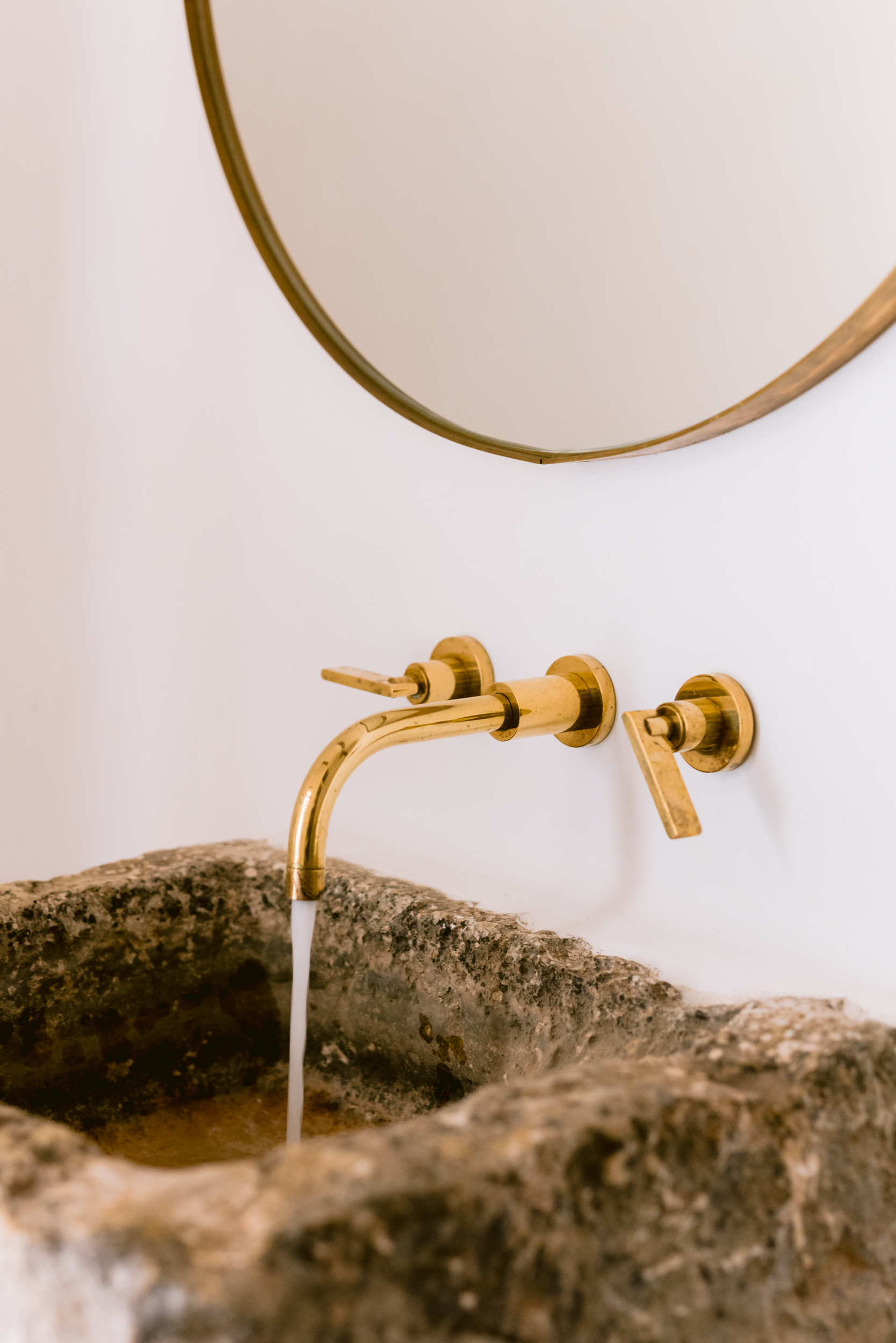 Brassware of a rustic bathroom in a luxury villa in Ibiza