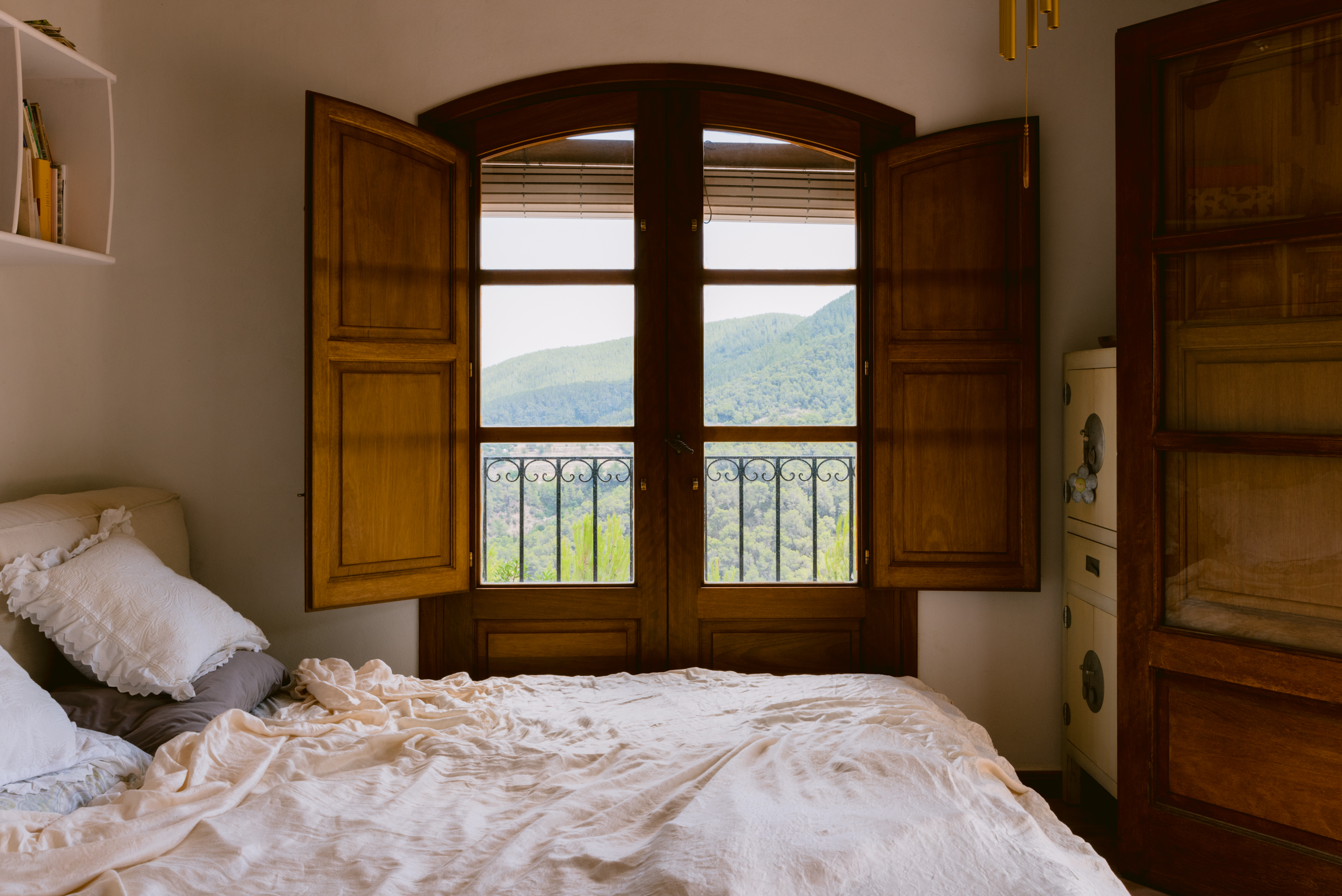 Wooden window shutters of rustic-luxe finca in northeast Ibiza
