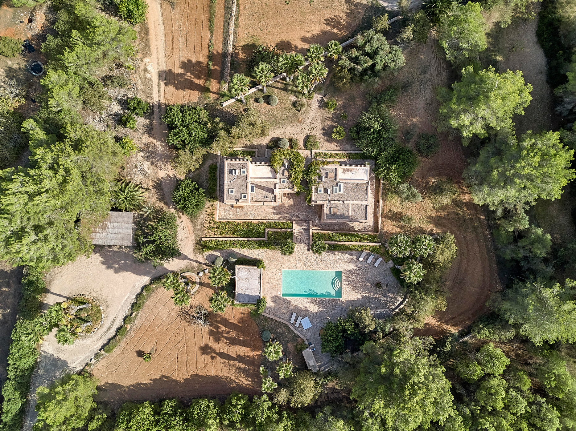 Aerial view showing the pool and casitas of a villa for sale in Ibiza