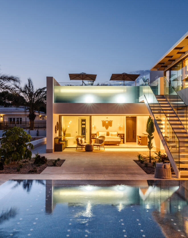 Luxury rental villa with a glass-sided pool in Ibiza