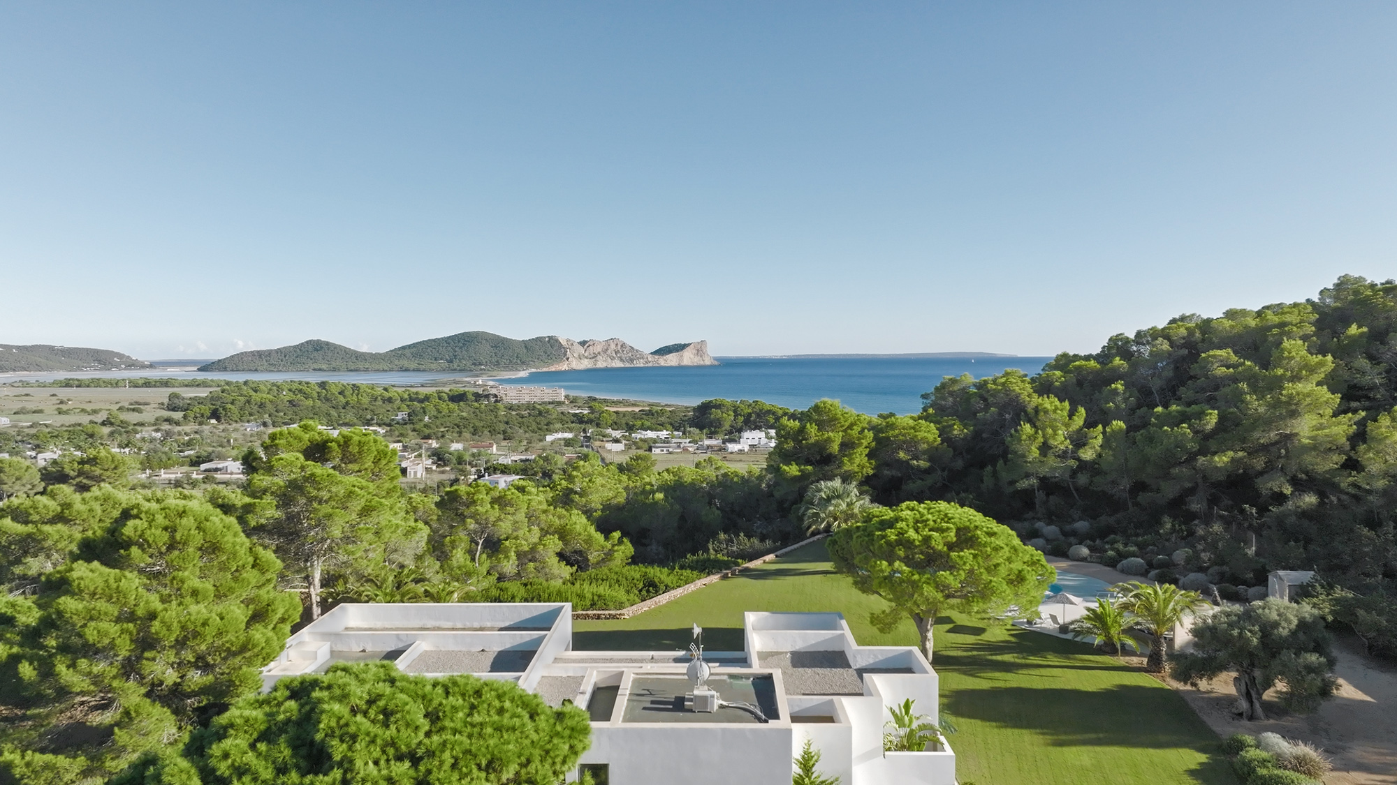Aerial view of a stunning, sculptural luxury villa to rent in Ibiza