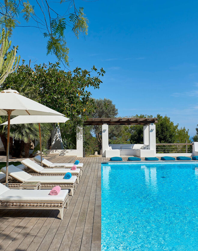 Sun loungers by a pool at a villa in Ibiza