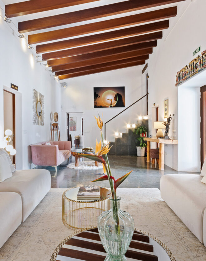 Exposed beams and unique artwork in a luxury rental villa in Ibiza