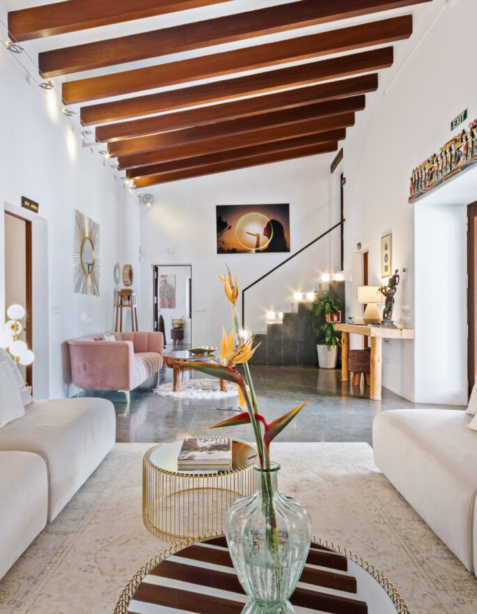 Exposed beams and unique artwork in a luxury rental villa in Ibiza