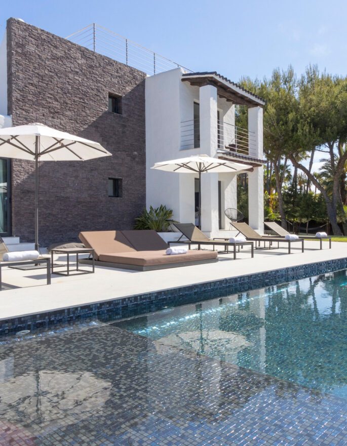 Luxury Ibizan villa reflected in a swimming pool