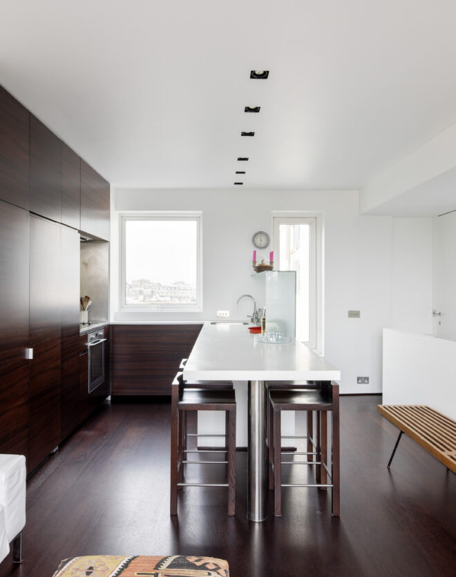 Minimalist open-plan kitchen of a luxury apartment for sale in Notting Hill