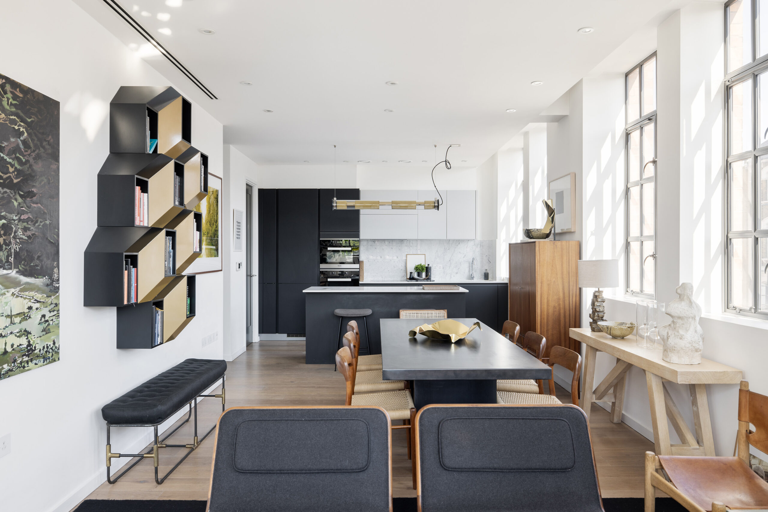 Contemporary kitchen and dining room of a luxurious loft-style apartment for rent in Highgate