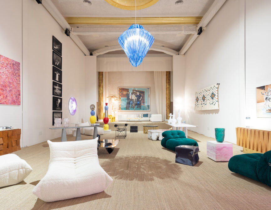 A design exhibition in an old cinema with bright colours and retro furniture