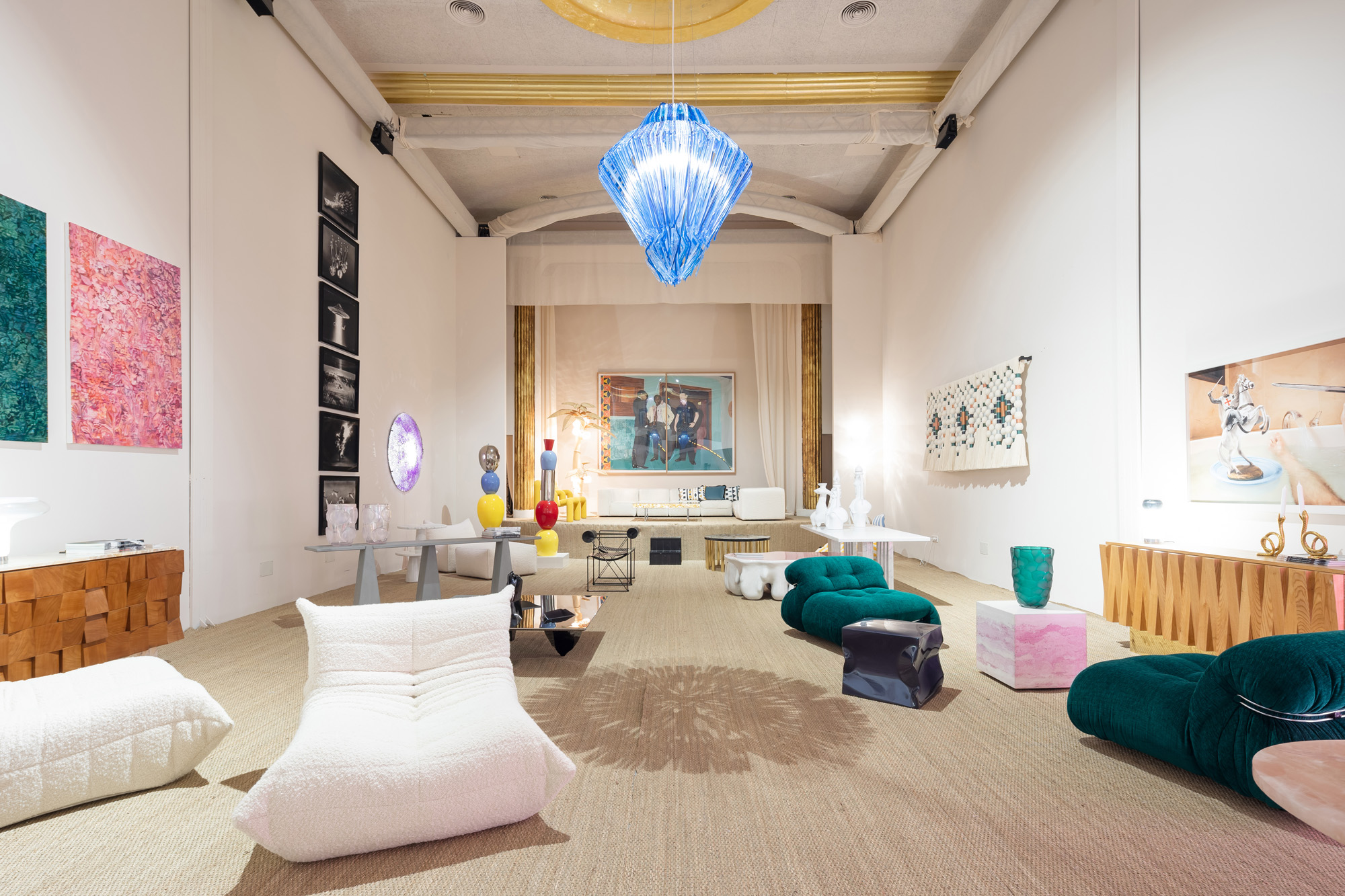 A design exhibition in an old cinema with bright colours and retro furniture