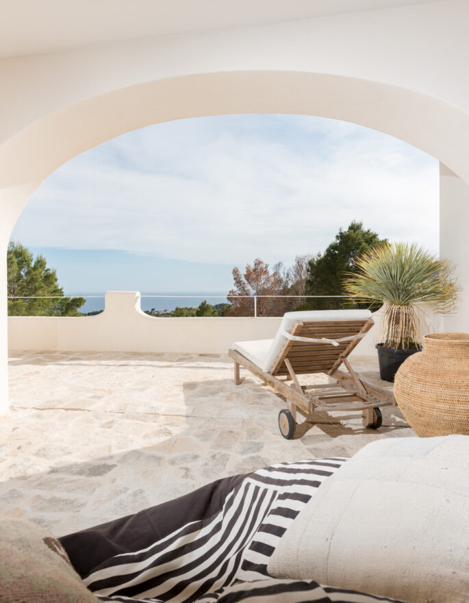 View through the archway out to the exterior of a luxury holiday home in Ibiza
