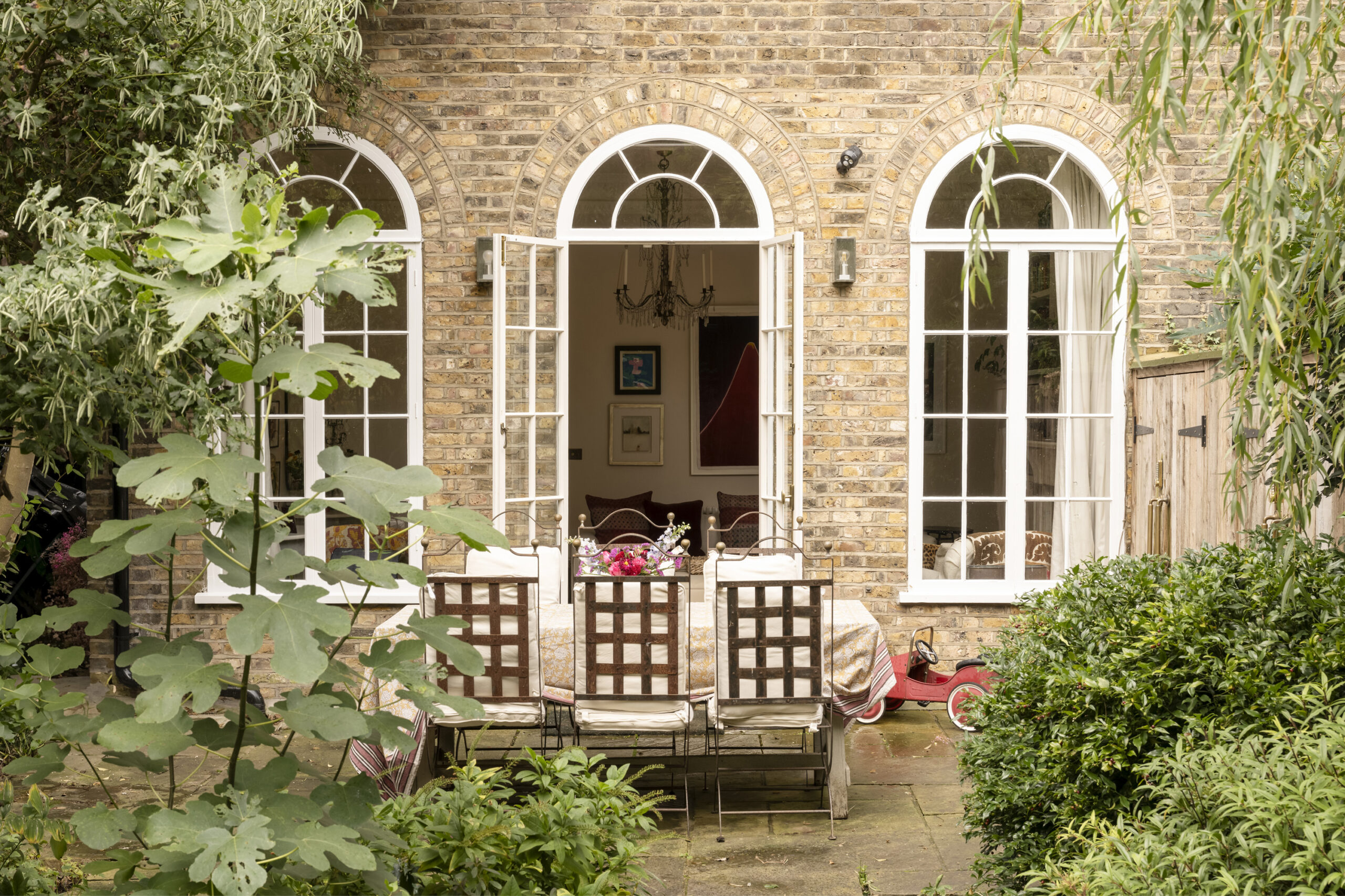Picturesque private garden of a three-bedroom maisonette for sale