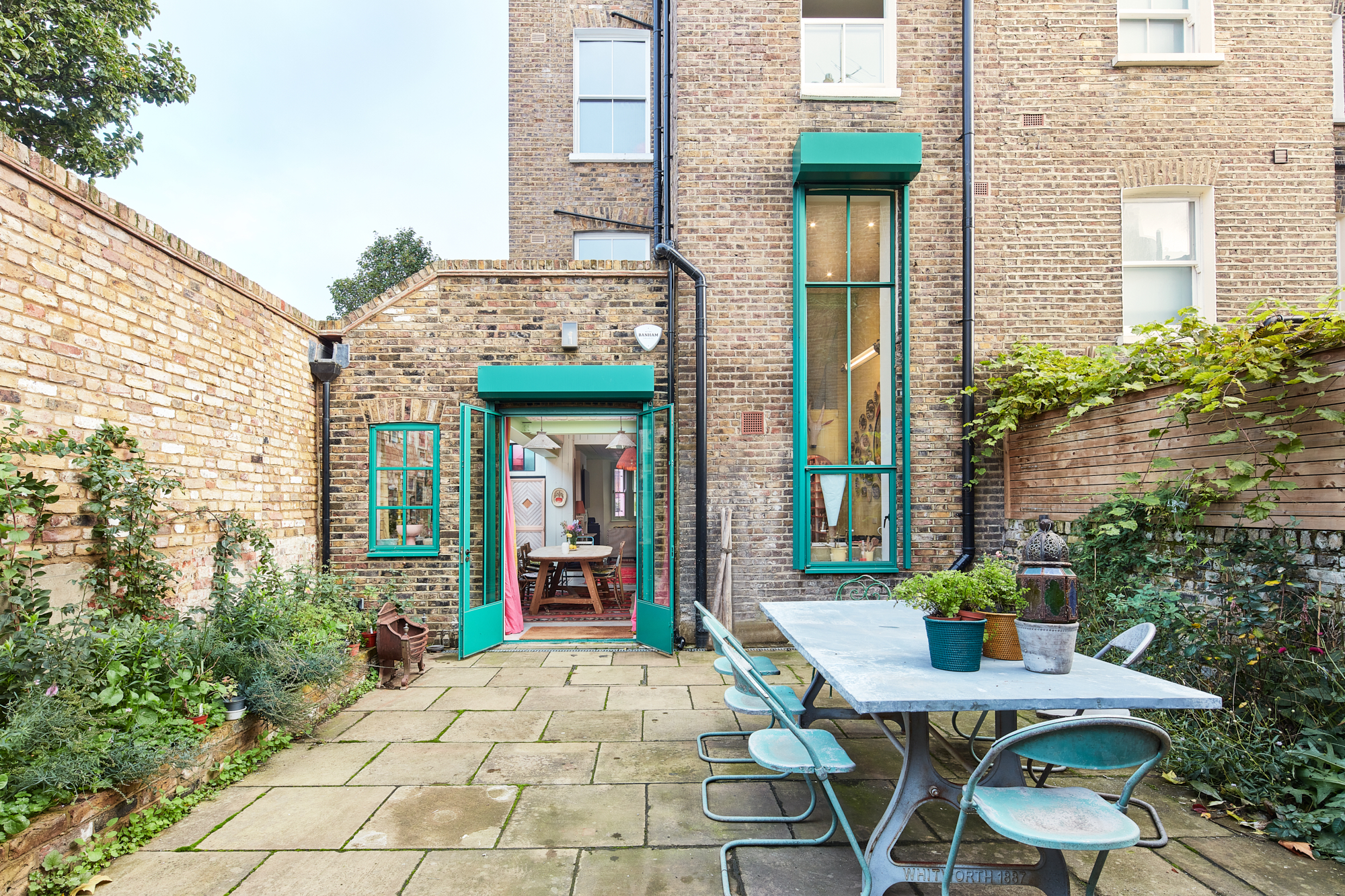 For Sale: Walterton Road Maida Hill W9 private garden with green panelled doors and windows