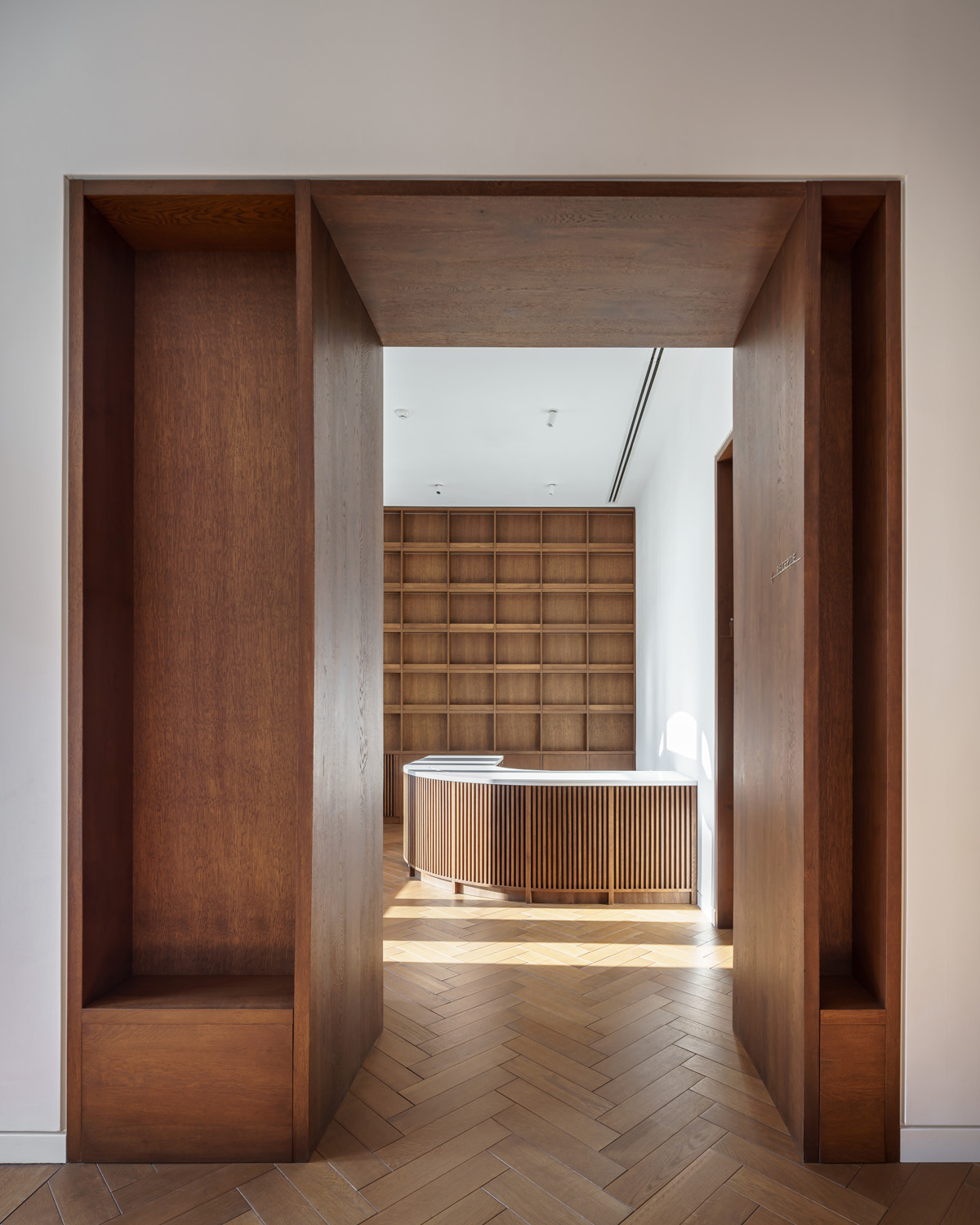 Wood-clad hallway by Manea Kella - luxury contemporary architects in London