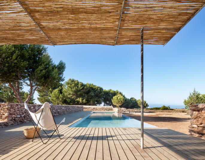 Pool and wooden decking by Marià Castelló - luxury modern architecture in Ibiza and Formentera