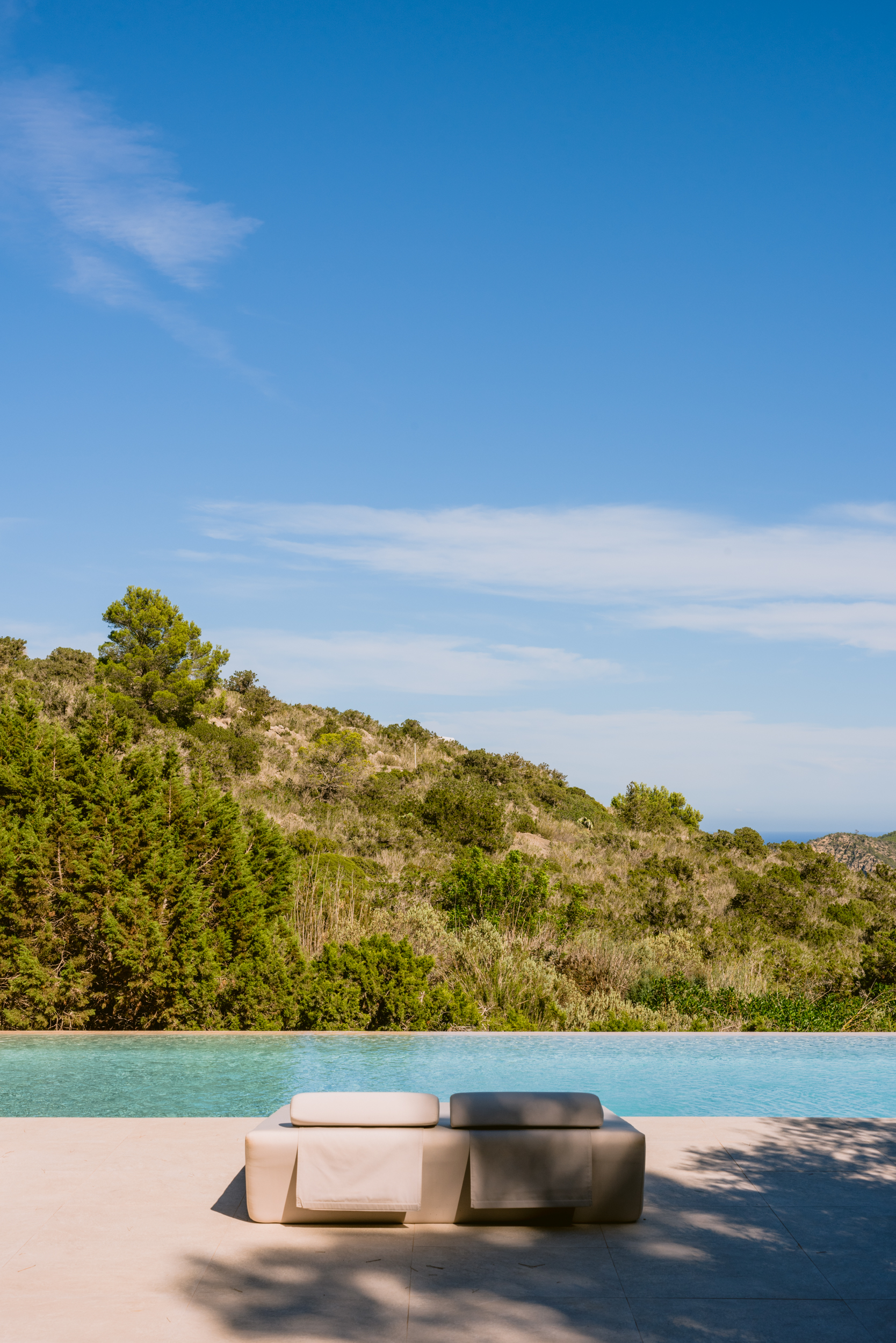 Uninterrupted hillside views from the pool of a luxury villa for sale in Ibiza