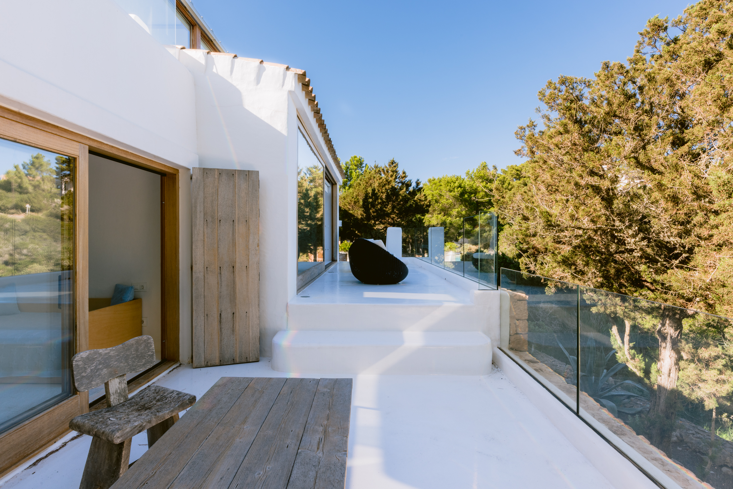 Gleaming white terrace of a luxury villa for sale in Ibiza