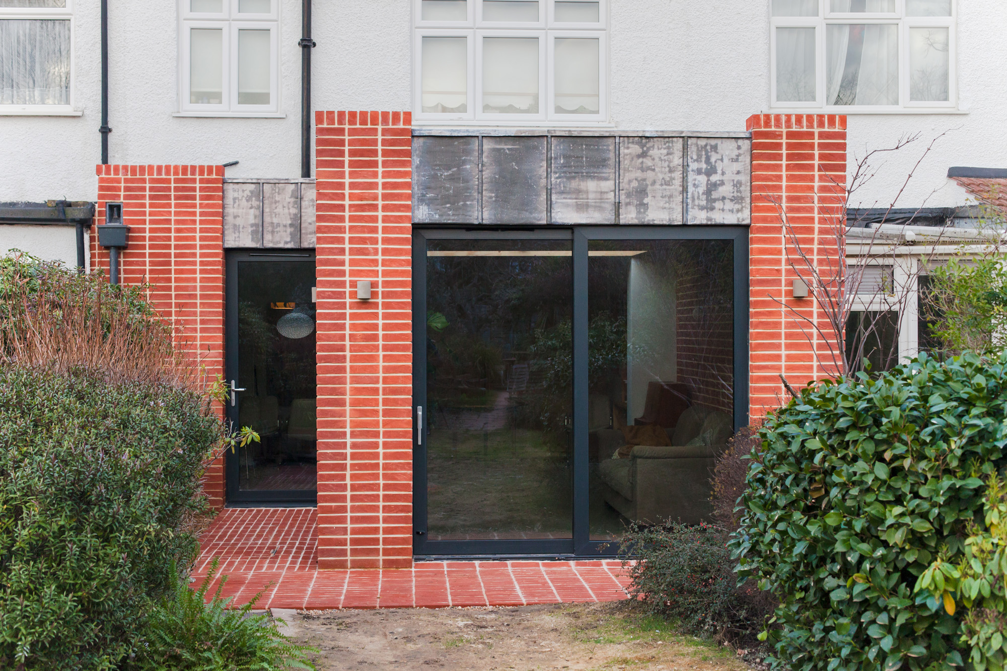 Red brick exteior by Nintim Architects - contemporary architecture design studio in London