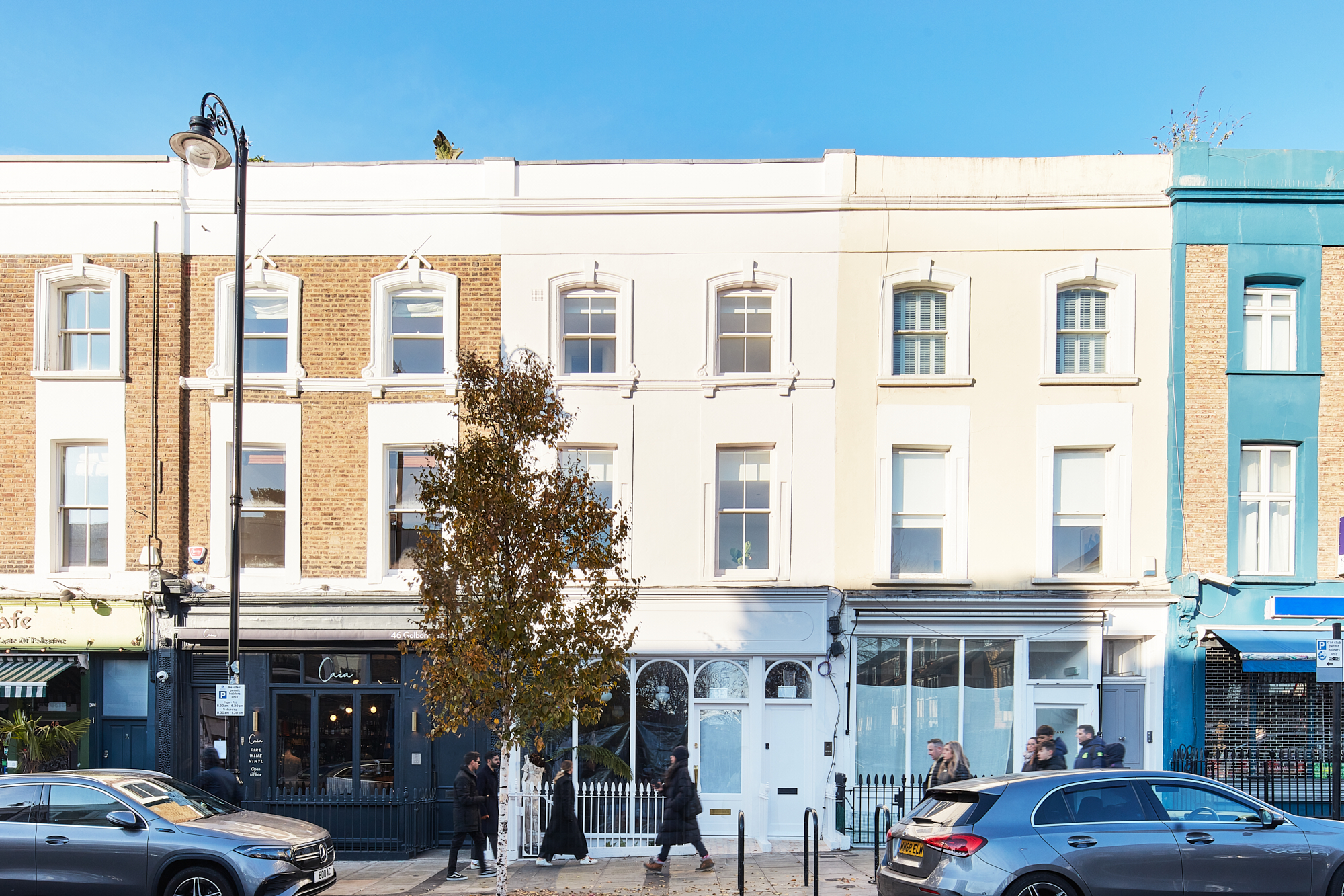 Pastel exterior of a luxury two-bedroom apartment for sale on Golborne Road in North Kensington