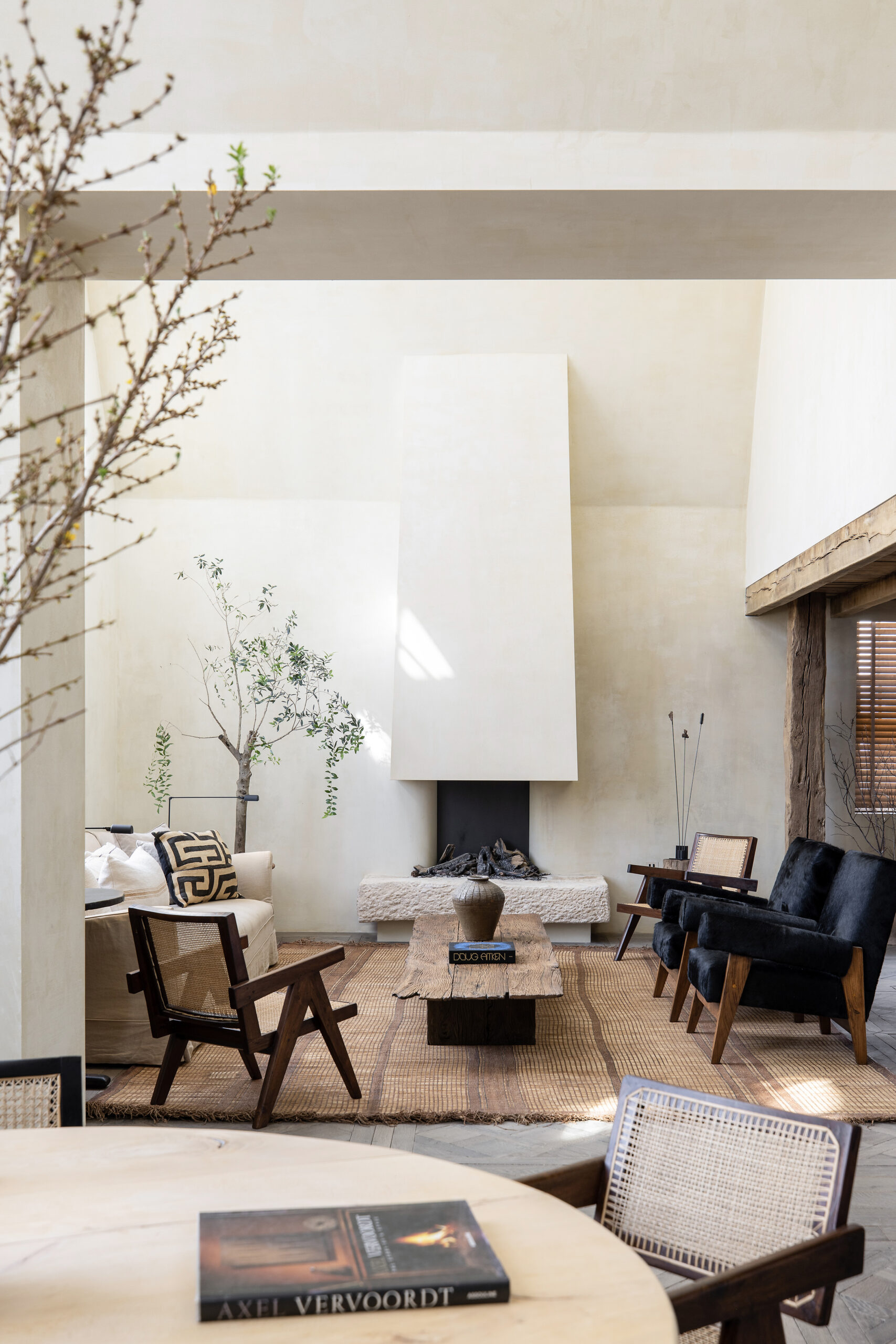 A fireplace grounds the living area of a luxury penthouse for rent in Notting Hill