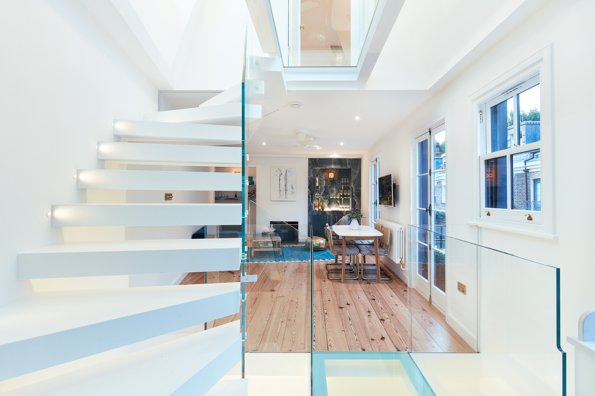Bright contemporary living room of a Notting Hill mews home for rent