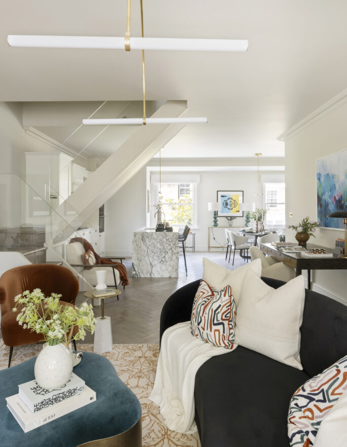 Luxury design-led reception room with herringbone floors in a three-bedroom duplex apartment for sale in Notting Hill