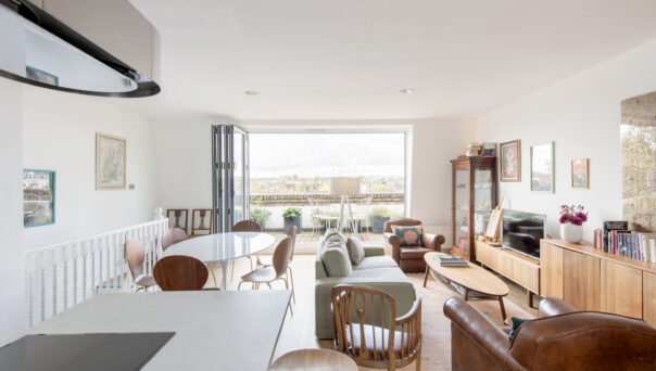 Luxury open-plan kitchen, dining and living room of a three-bedroom duplex for sale in Notting Hill