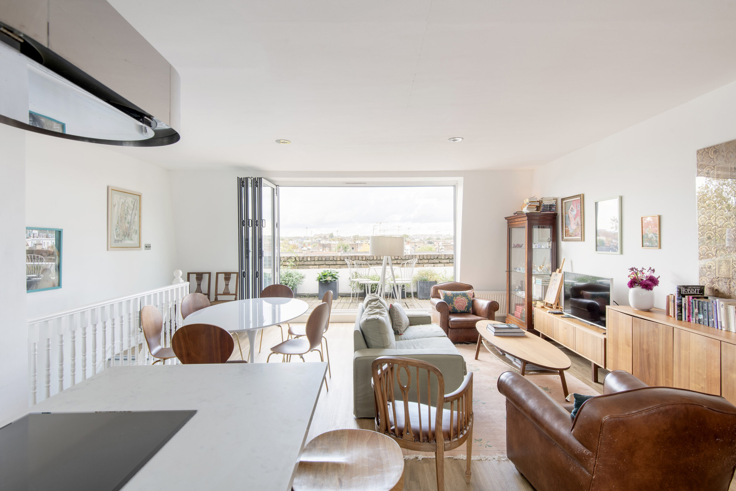 Luxury open-plan kitchen, dining and living room of a three-bedroom duplex for sale in Notting Hill