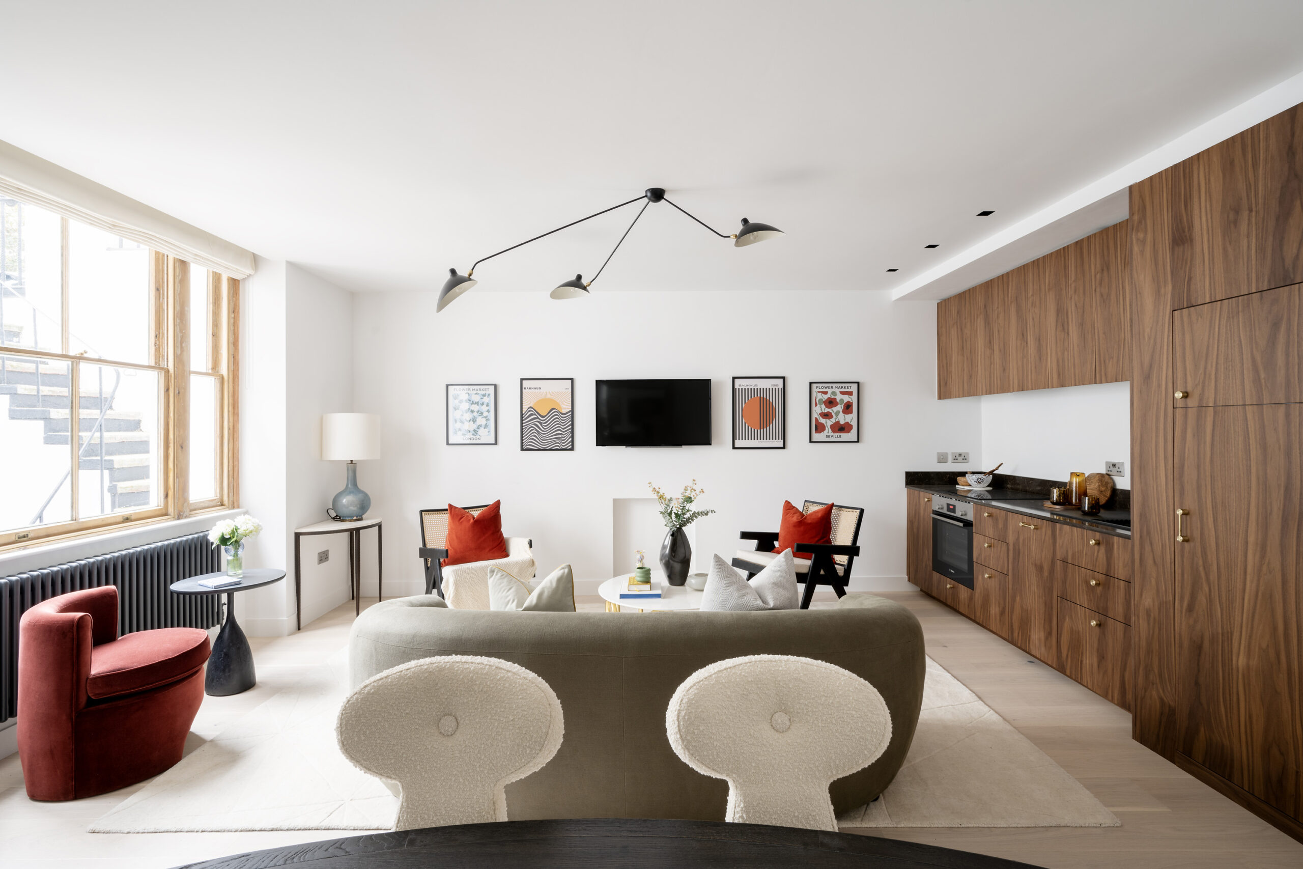 Luxury open-plan kitchen and reception room of a two-bedroom maisonette for sale in Notting Hill