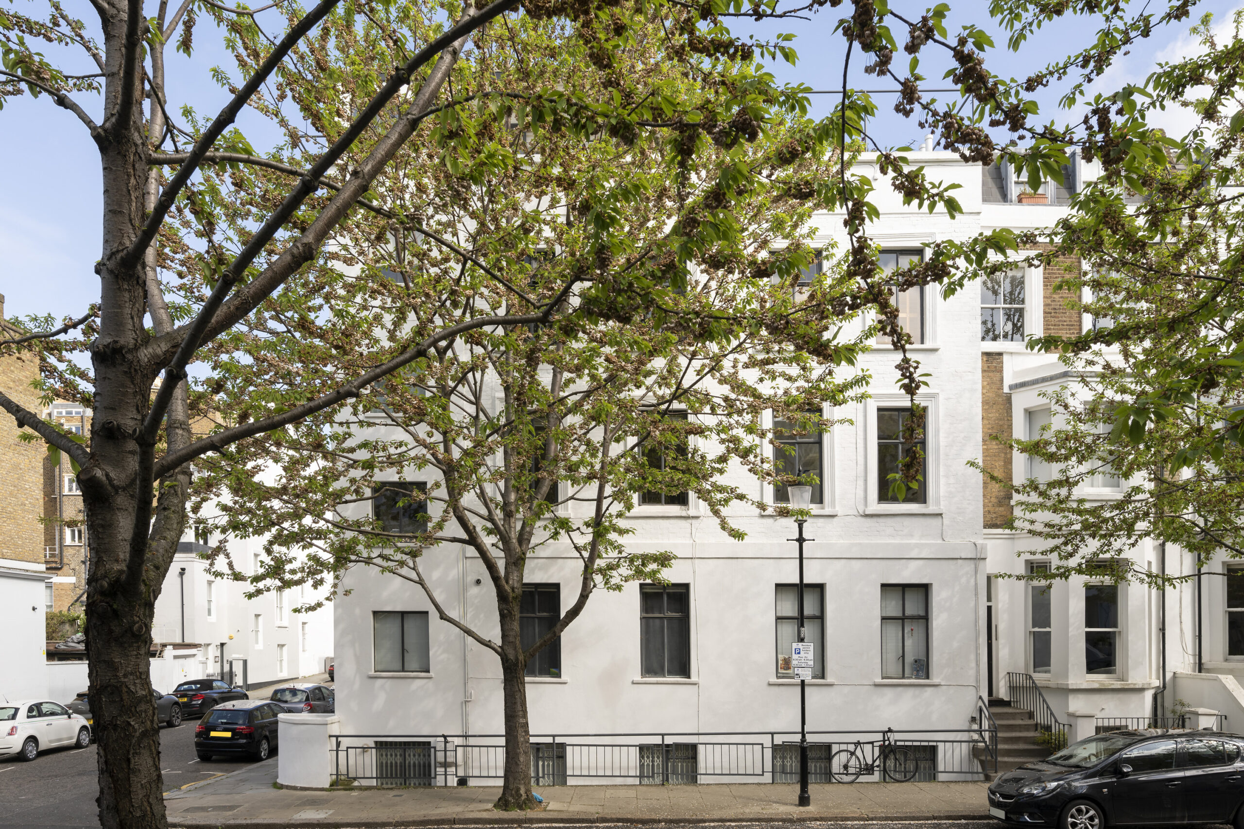 Traditional stucco exterior of a luxury apartment for sale in North Kensington