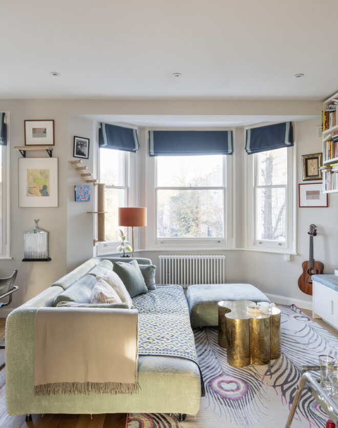Bright luxury reception room with a large bay window in a one-bedroom Notting Hill apartment for sale