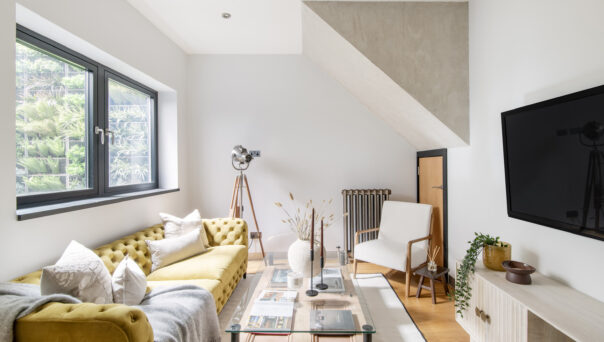 Bright minimalist reception room of a luxury duplex apartment for sale in Notting Hill