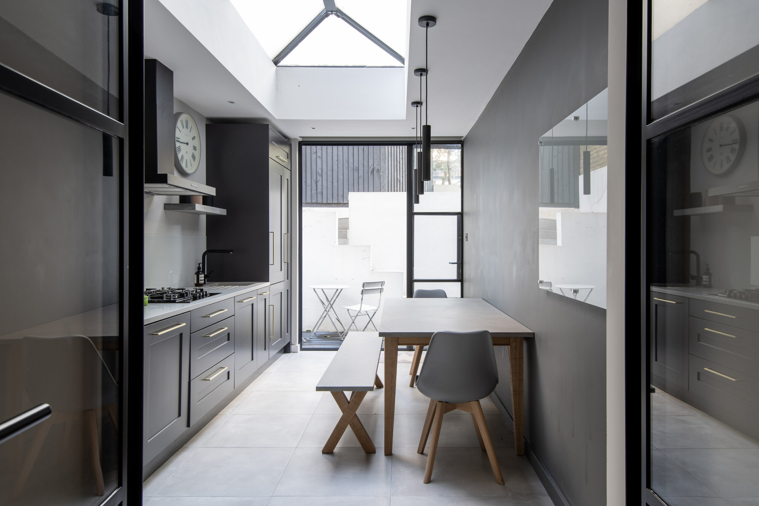 Minimalist style sky-lit kitchen in a two-bedroom apartment for sale in Notting Hill