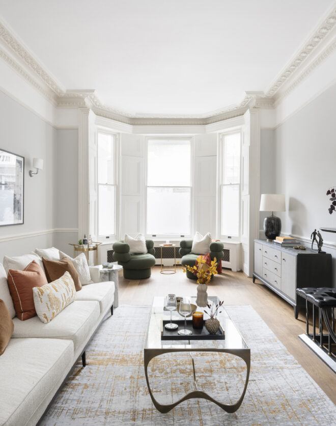 Sophisticated living room with feature fireplace in a luxury duplex for sale in Notting Hill