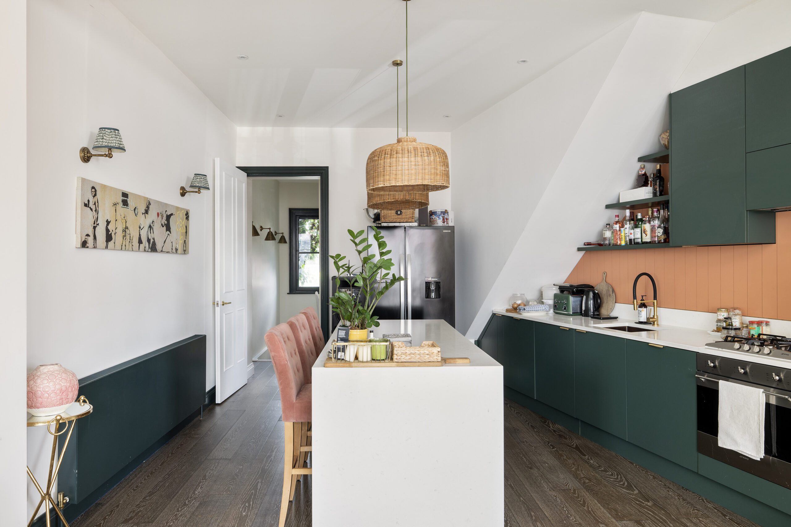 Dark green contemporary kitchen in a stylish two-bedroom maisonette for sale