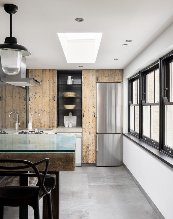 Modern industrial style kitchen of a two-bedroom triplex apartment on Portobello Road